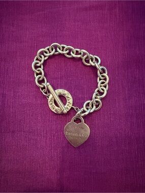 Tiffany & Co. Sterling Silver Heart Tag Toggle Bracelet in Silver on Purple